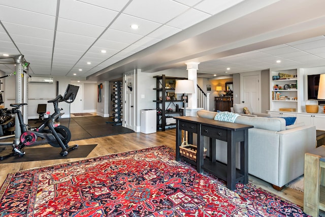 27 Gully Ln, East Sandwich, MA 02537 - exercise room with wood finished floors and a wall mounted air conditioner