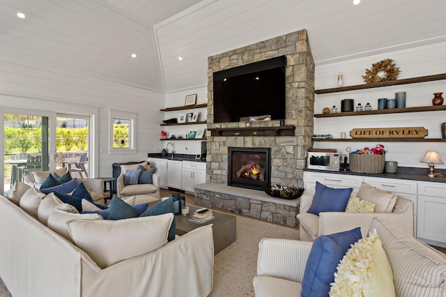 27 Gully Ln, East Sandwich, MA 02537 - living room featuring a fireplace, lofted ceiling, wood walls, and recessed lighting