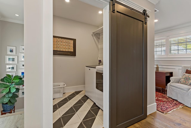 27 Gully Ln, East Sandwich, MA 02537 - laundry area featuring washer / clothes dryer, ornamental molding, a barn door, recessed lighting, and tile patterned flooring