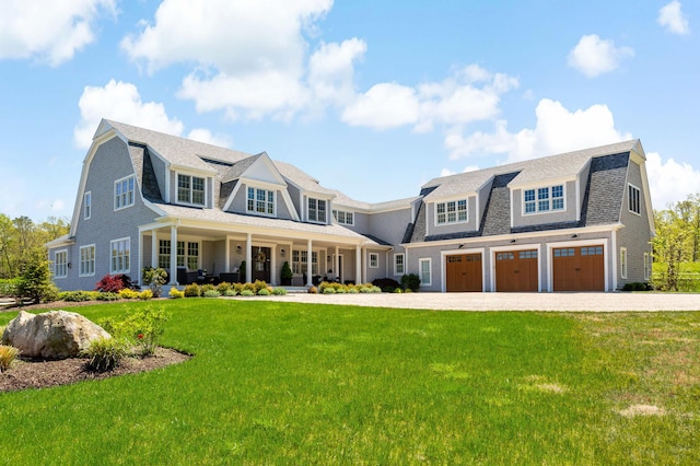 27 Gully Ln, East Sandwich, MA 02537 - shingle-style home with a gambrel roof, an attached garage, a porch, and a front lawn