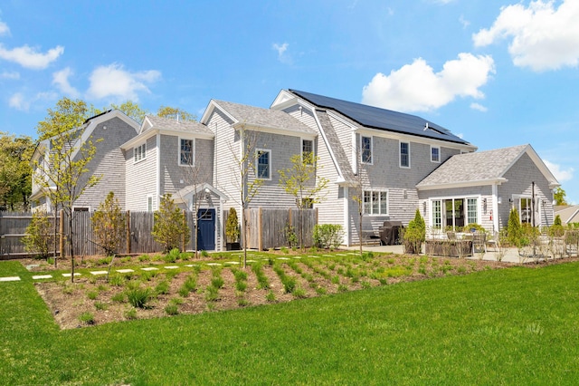 27 Gully Ln, East Sandwich, MA 02537 - back of property featuring a patio area and a shingled roof