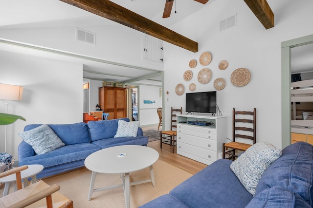 22 Wixon Rd, Dennis Port, MA 02639 - living room featuring beamed ceiling, a ceiling fan, wood finished floors, and high vaulted ceiling