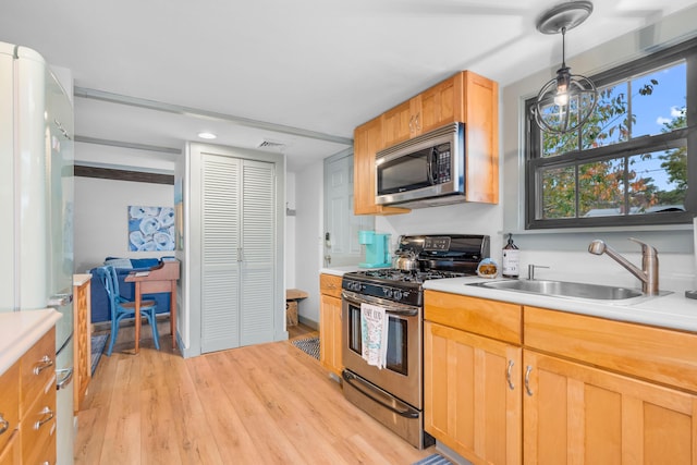 22 Wixon Rd, Dennis Port, MA 02639 - kitchen featuring stainless steel appliances, light countertops, light wood-style flooring, decorative light fixtures, and recessed lighting
