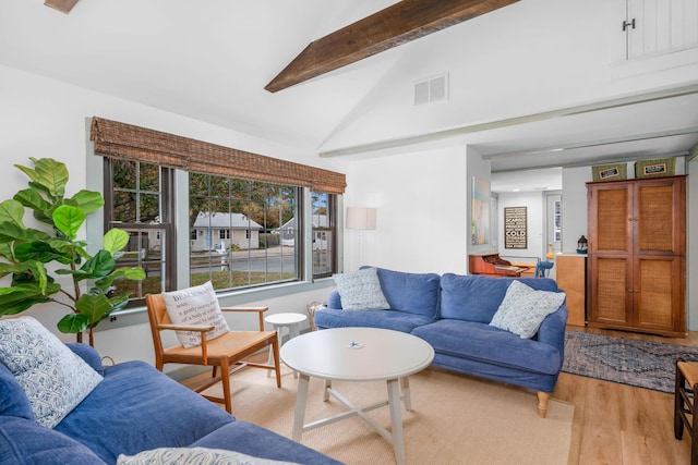 22 Wixon Rd, Dennis Port, MA 02639 - living room with light wood-style flooring, beamed ceiling, and high vaulted ceiling