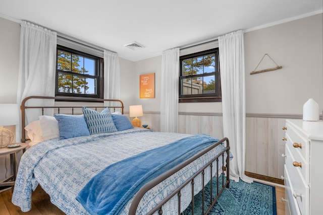 22 Wixon Rd, Dennis Port, MA 02639 - bedroom with wood finished floors, wainscoting, and ornamental molding