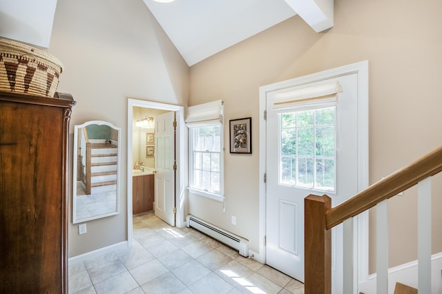 20 Hoyt Rd, Eastham, MA 02642 - foyer entrance featuring baseboard heating, stairs, light tile patterned floors, baseboards, and high vaulted ceiling