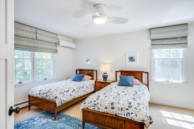 20 Hoyt Rd, Eastham, MA 02642 - bedroom with a wall mounted AC, a baseboard radiator, light colored carpet, and baseboards