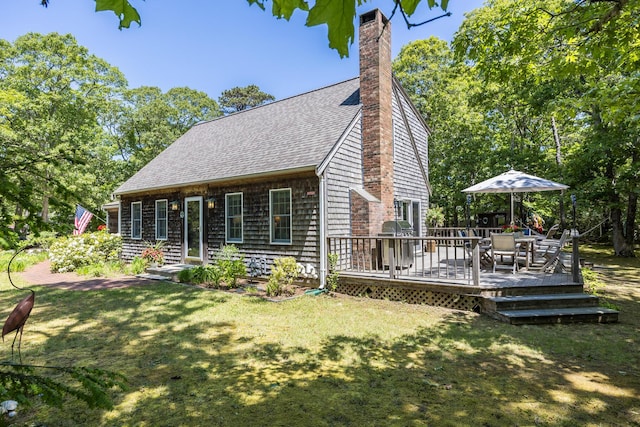 20 Hoyt Rd, Eastham, MA 02642 - back of house with a shingled roof, a yard, a chimney, and a deck