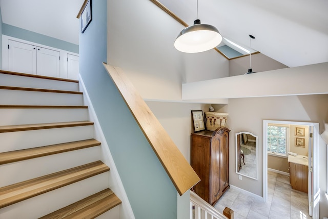 20 Hoyt Rd, Eastham, MA 02642 - stairs with high vaulted ceiling, tile patterned floors, and baseboards