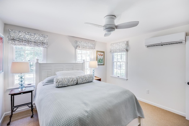 20 Hoyt Rd, Eastham, MA 02642 - bedroom with a wall unit AC, carpet floors, baseboards, and ceiling fan