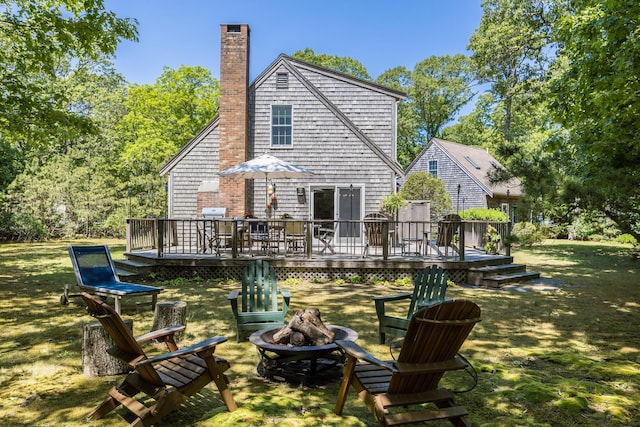 20 Hoyt Rd, Eastham, MA 02642 - back of house with an outdoor fire pit, a chimney, and a deck