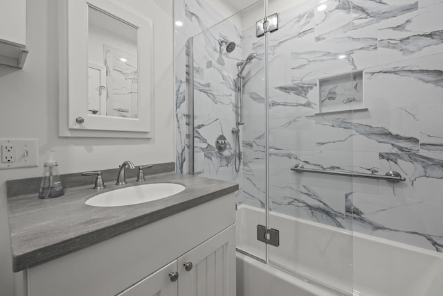 full bathroom with shower / bath combination with glass door and vanity