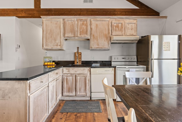 kitchen featuring dark wood-style flooring, lofted ceiling with beams, light brown cabinetry, white appliances, and under cabinet range hood