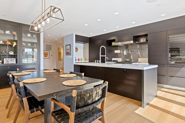 dining space featuring sink and light hardwood / wood-style flooring