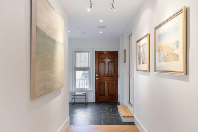 interior space featuring dark tile patterned flooring