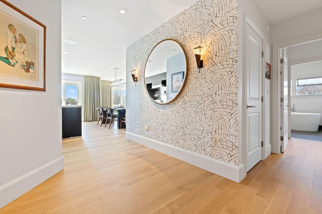 corridor with hardwood / wood-style flooring