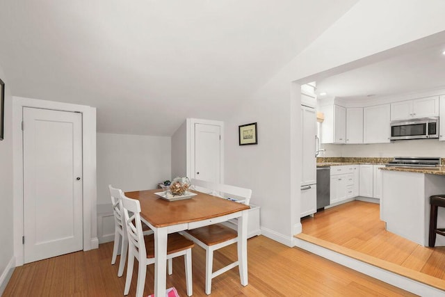 33 Beach Rd, Orleans, MA 02653 - dining room featuring light wood-style floors, lofted ceiling, and recessed lighting