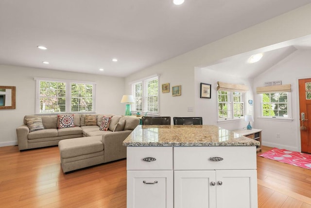 33 Beach Rd, Orleans, MA 02653 - kitchen with healthy amount of natural light, white cabinets, light wood-style flooring, recessed lighting, and vaulted ceiling