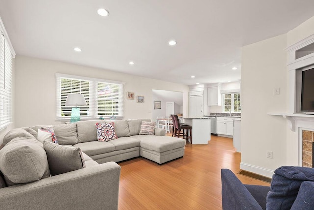 33 Beach Rd, Orleans, MA 02653 - living room featuring light wood-type flooring, recessed lighting, and a fireplace