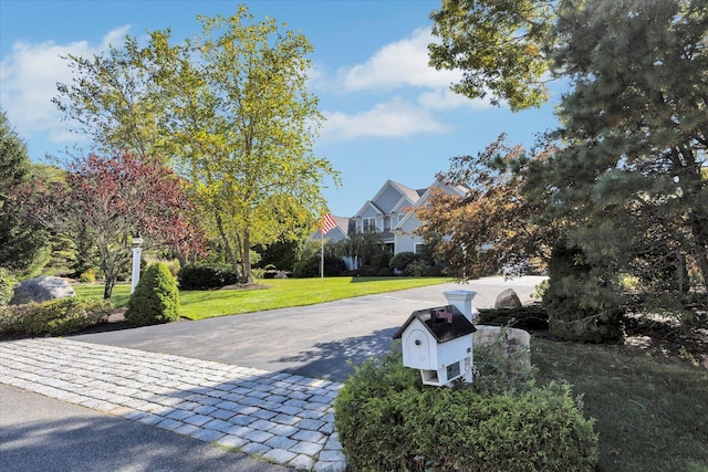 view of road with driveway and a residential view