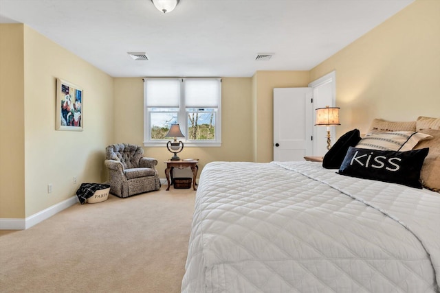 carpeted bedroom featuring baseboards and visible vents