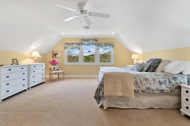 bedroom with visible vents, baseboards, ceiling fan, light colored carpet, and vaulted ceiling