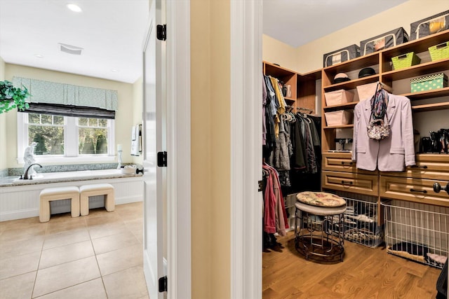 spacious closet featuring light tile patterned floors