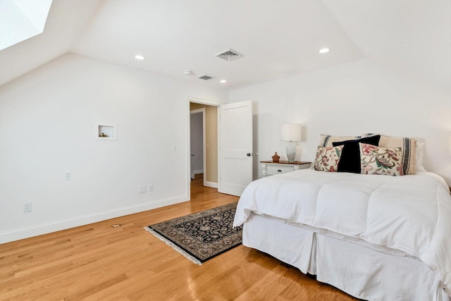 bedroom with visible vents, recessed lighting, baseboards, and wood finished floors
