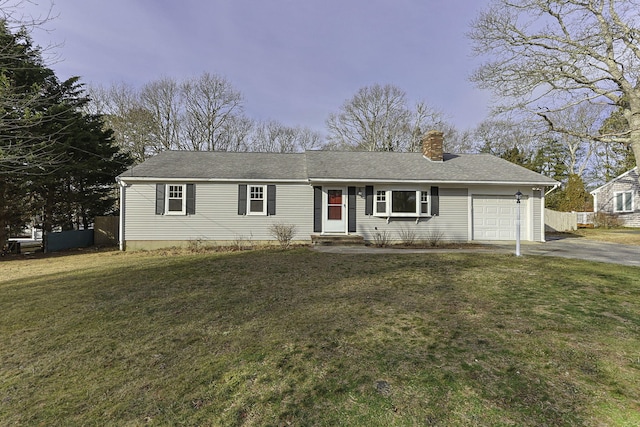 single story home with a garage and a lawn