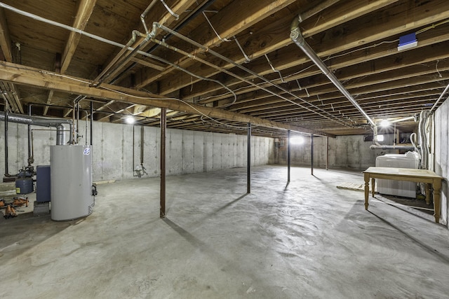 basement featuring washer / dryer and water heater