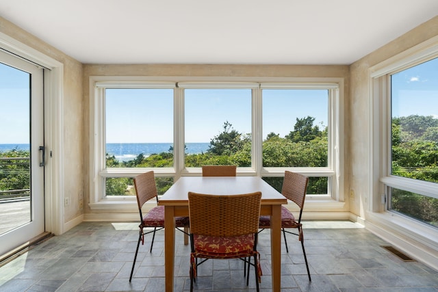 142 Greely Ave, Centerville, MA 02632 - sunroom with stone tile flooring, healthy amount of natural light, and a water view