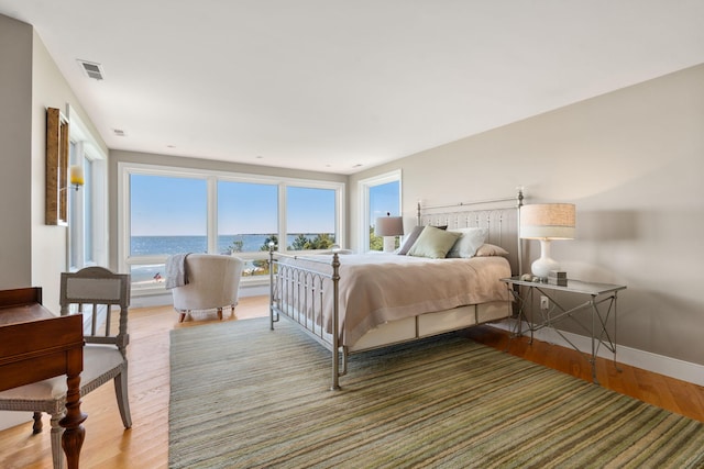 142 Greely Ave, Centerville, MA 02632 - bedroom with wood finished floors and a water view