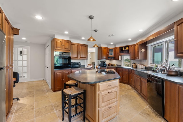 142 Greely Ave, Centerville, MA 02632 - kitchen featuring black appliances, dark countertops, a breakfast bar, recessed lighting, and a kitchen island