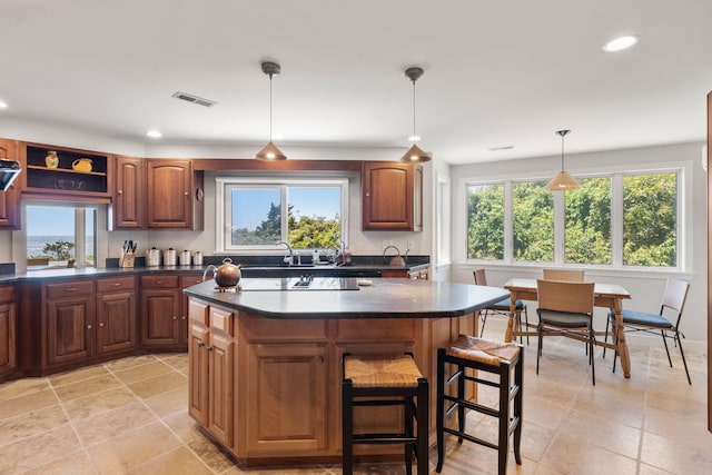 142 Greely Ave, Centerville, MA 02632 - kitchen featuring dark countertops, healthy amount of natural light, a kitchen island, and recessed lighting