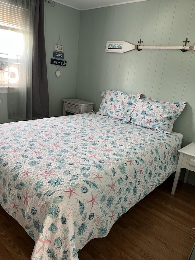 bedroom with dark wood-type flooring