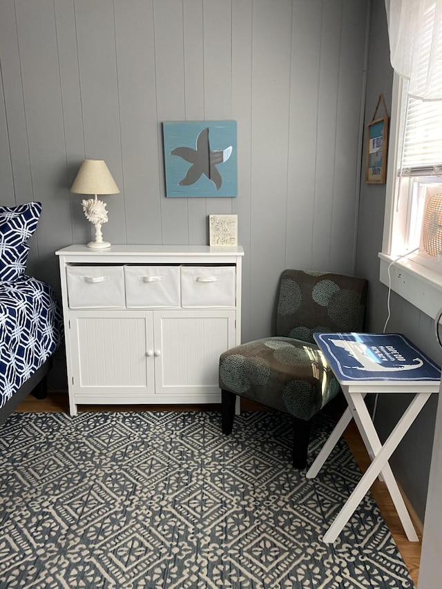 sitting room with wood walls