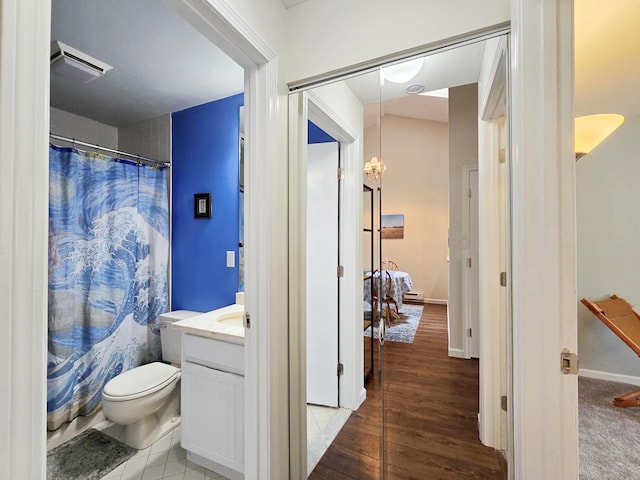 full bath with vanity, wood finished floors, toilet, and a shower with shower curtain