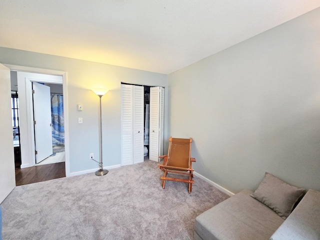 sitting room with carpet floors and baseboards
