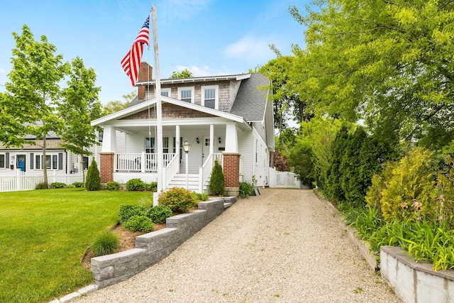 12 Dartmouth St, Hyannis, MA 02601 - view of front facade featuring a porch and driveway