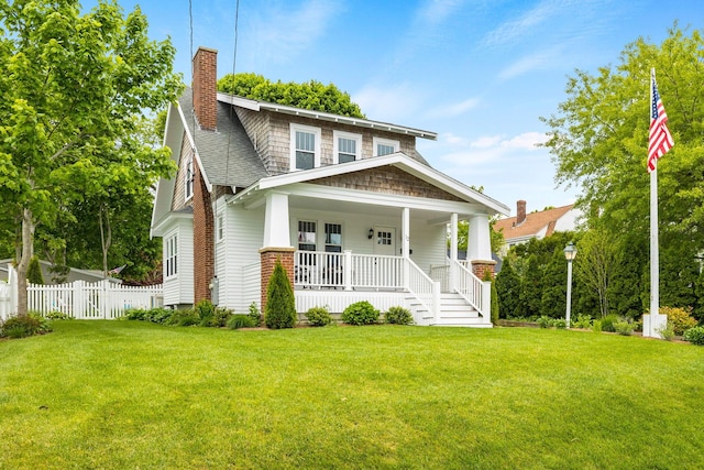 12 Dartmouth St, Hyannis, MA 02601 - view of front of property featuring covered porch, a chimney, and roof with shingles