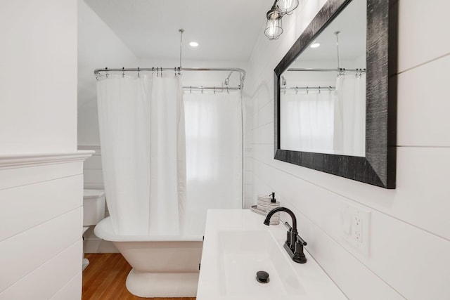 12 Dartmouth St, Hyannis, MA 02601 - bathroom featuring vanity, recessed lighting, wood finished floors, toilet, and shower / bath combo with shower curtain