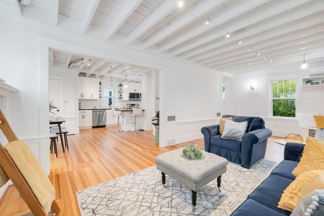 12 Dartmouth St, Hyannis, MA 02601 - living area featuring beam ceiling and light wood finished floors