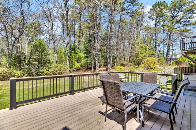 wooden terrace with outdoor dining area