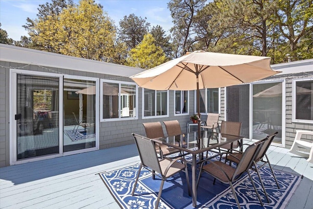 deck with outdoor dining area