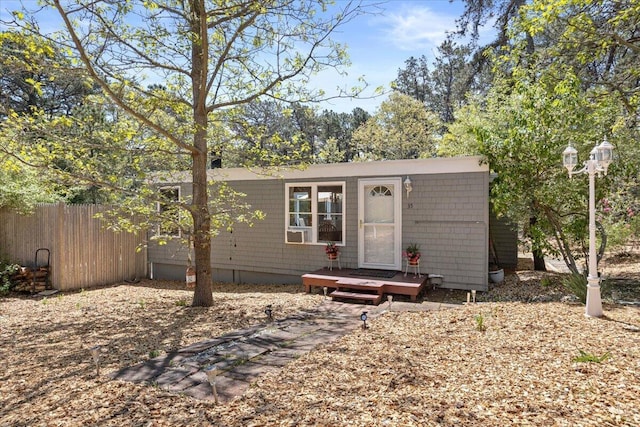 view of front of property featuring fence