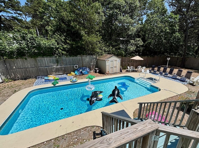 35 Tecumseh Rd, Wellfleet, MA 02667 - view of pool featuring a fenced backyard, a shed, a patio area, and view of wooded area