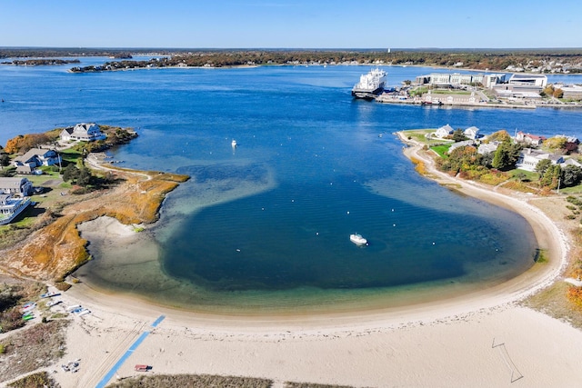 birds eye view of property featuring a water view and a view of the beach