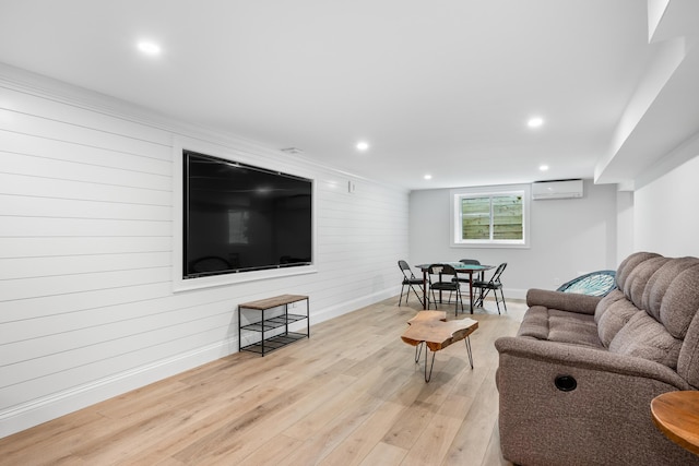 290 Riverview Ln, Centerville, MA 02632 - living room featuring a wall unit AC, light wood-style flooring, baseboards, recessed lighting, and wood walls