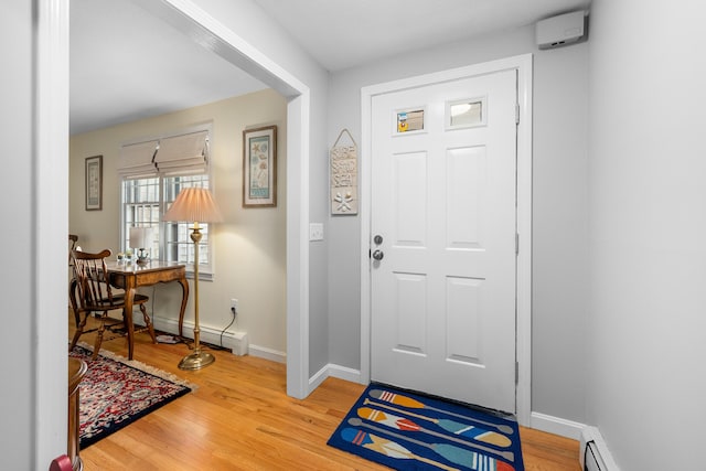 290 Riverview Ln, Centerville, MA 02632 - foyer with a baseboard heating unit, wood finished floors, and baseboards