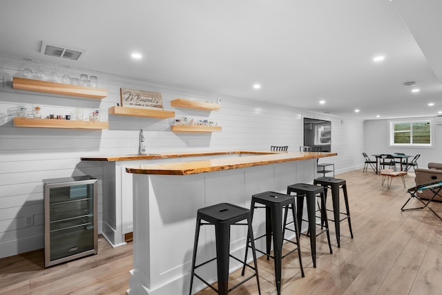290 Riverview Ln, Centerville, MA 02632 - indoor wet bar featuring beverage cooler, light wood-style floors, recessed lighting, and baseboards